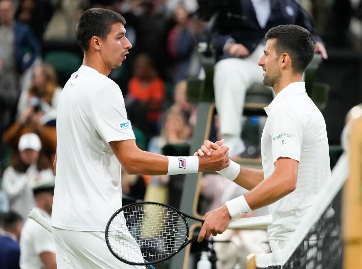 Djokovic reazione risata Wimbledon